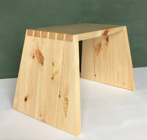 This step-stool is made from 3 pieces of southern yellow pine joined with 12 hand-cut angled dovetail joints. This makes for a very light but extremely strong stool.  Also available in cherry or oak.   H320mm  W502mm   Depth at top 222mm  Depth at bottom 336mm  Handmade in Ireland for Gallery33